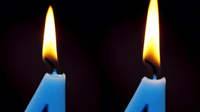 4k镜头垂直视频前视图延时，燃烧四号生日蜡烛，黑色背景上有火。