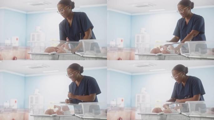 妇产医院病房: 友好的黑人护士长照顾新生婴儿。非洲儿科医生在托儿所进行检查时将婴儿放回摇篮