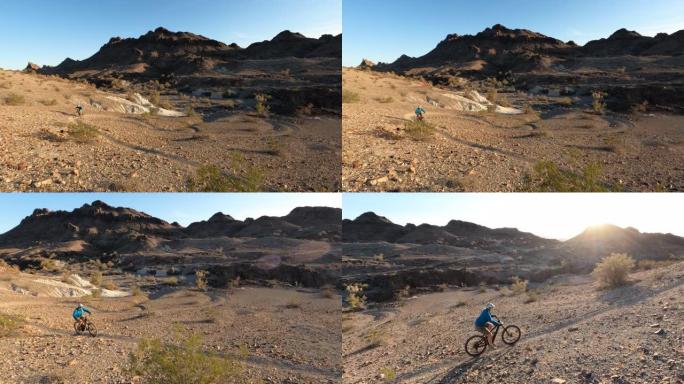 成熟女子在沙漠小径上骑电动自行车