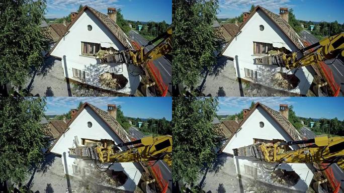 LD挖掘机在旧建筑物的外墙上打洞