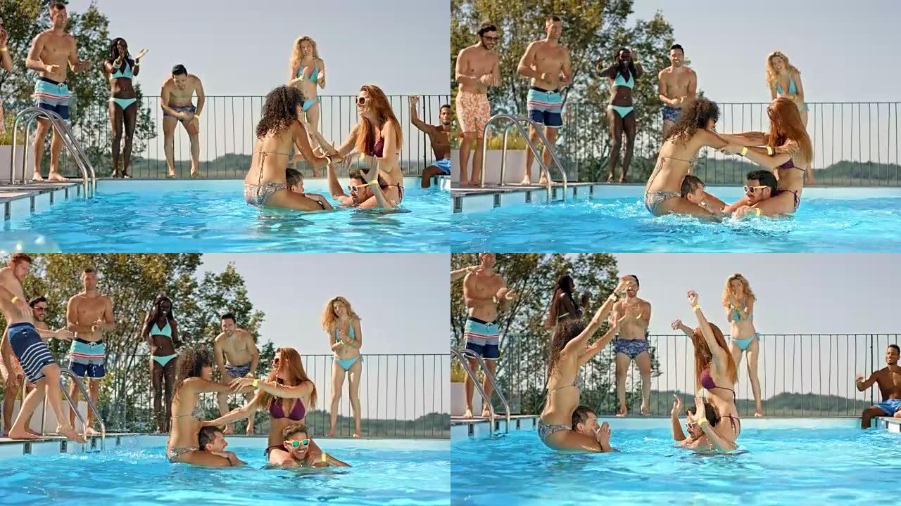 SLO MO DS两个女人在游泳池里打架，他们的朋友站在游泳池旁为他们加油
