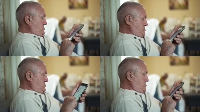 双下巴老人使用智能手机