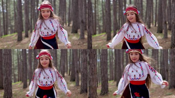 保加利亚女孩在传统民俗服装跑在森林在山，4k慢动作视频。保加利亚自然与人。