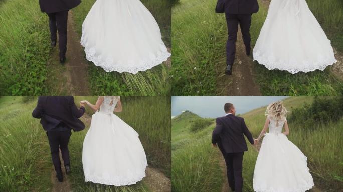 新娘和新郎夫妇在阴天慢动作的草地上奔跑