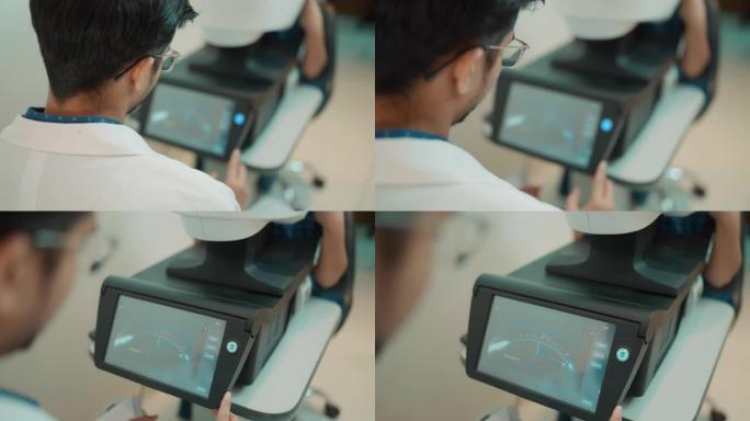 眼科医生使用设备检查患者的眼睛。