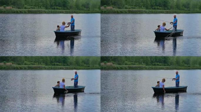 母亲，父亲和小儿子在湖上的船上放松