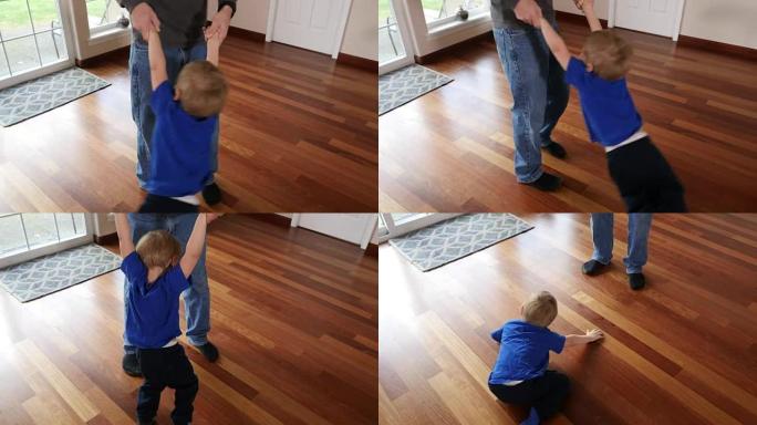 父亲旋转儿子在家里arroung