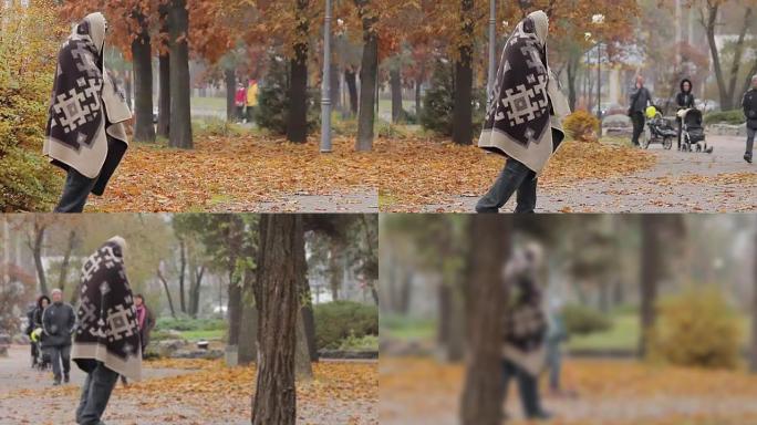 秋公园里不快乐的乞丐一瘸一拐，社会脆弱性和贫困问题