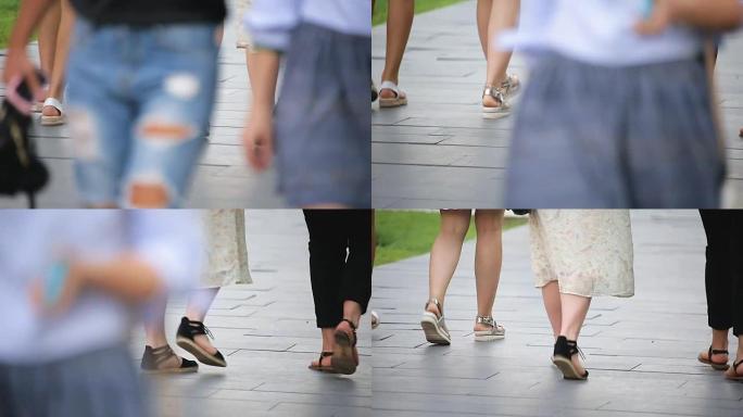 女性朋友一起在公园散步，在户外度过时光，双腿特写