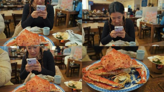 女人用智能手机给海鲜拍照
