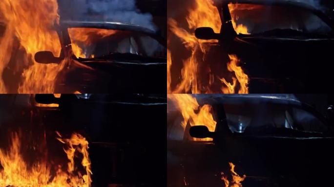撞毁车辆在夜间车祸现场从地面燃烧的燃料着火
