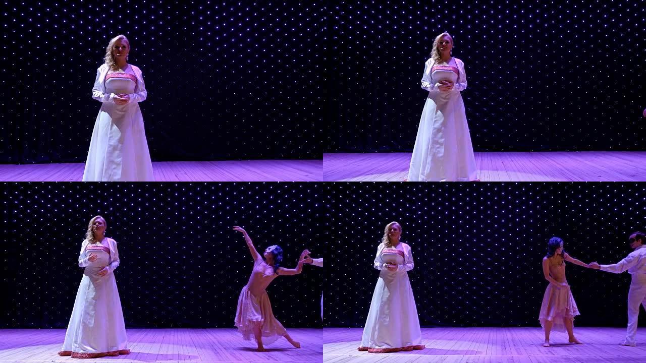 美丽的女人穿着白色长裙在舞台上唱着性感的歌曲