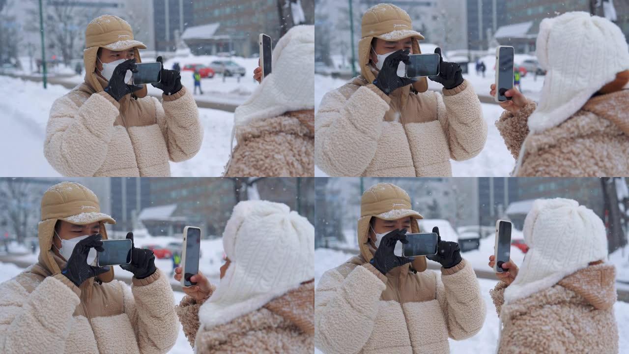 夫妇在冬天旅行时拍摄卷轴视频