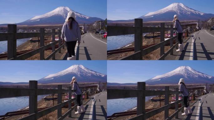 女人看着山中湖和富士山