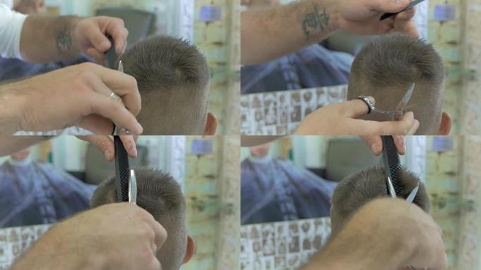 专业造型师在理发店用剪刀剪掉小男孩的头发