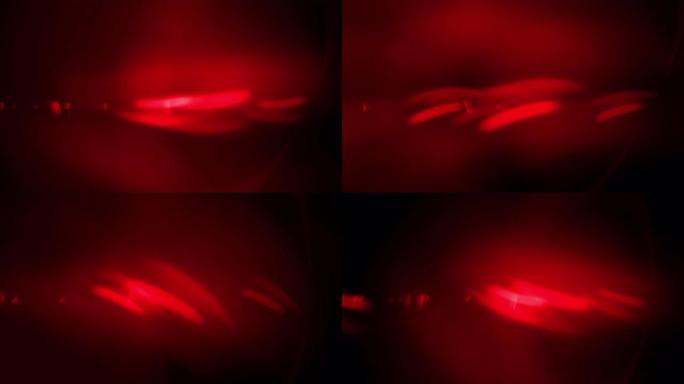抽象动画背景闪耀红星粒子光线的痕迹。密教、神秘主义、魔法、神圣知识。4K.循环