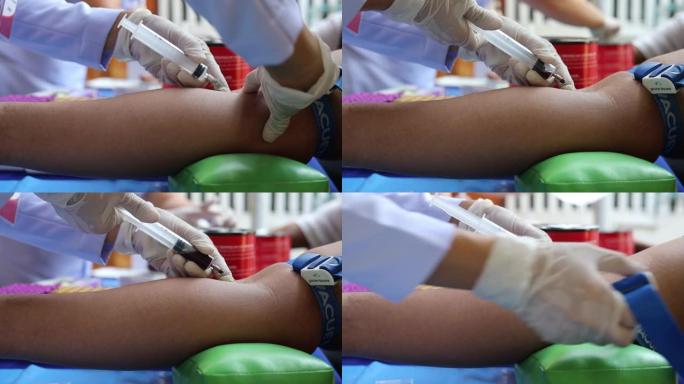 图为戴着白色橡胶手套的年轻护士正在用注射器穿刺手臂主动脉。
