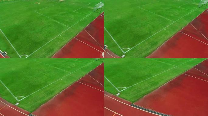 足球场的跑道和角球，颜色为橙色砖，无人机高角度视角。