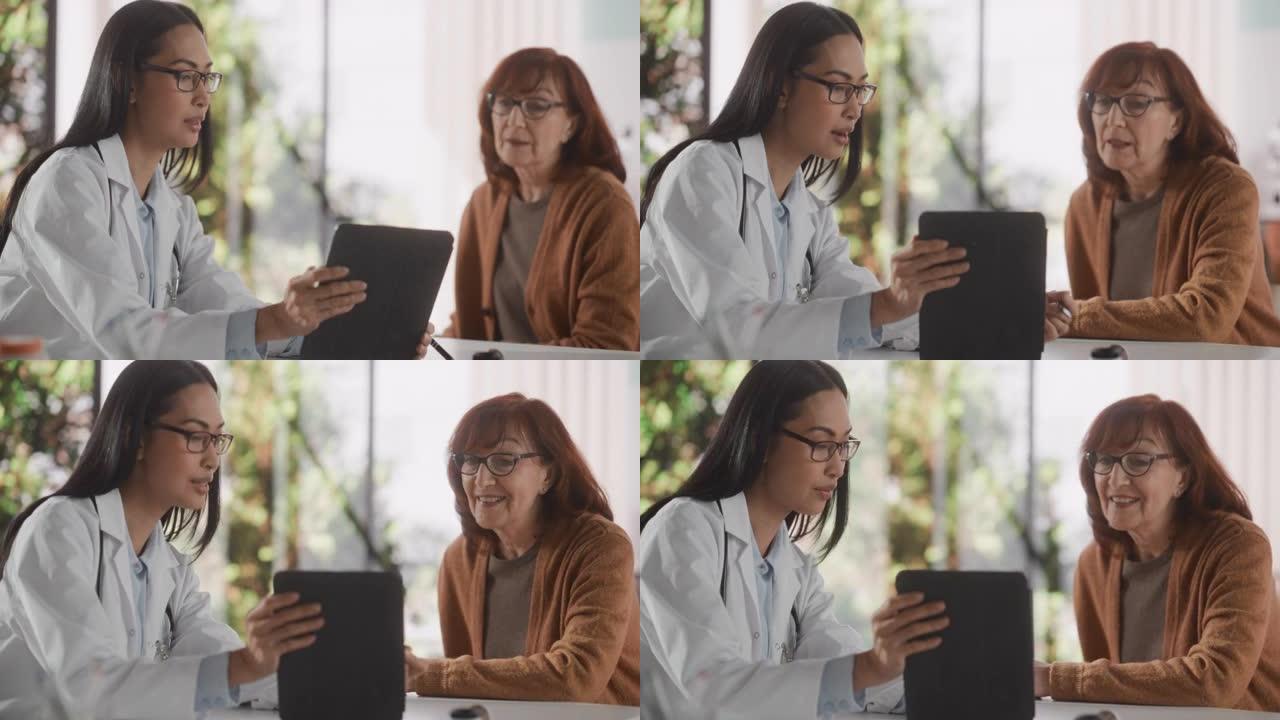 女医师在健康诊所咨询期间向中年患者展示平板电脑和医学测试结果。家庭医生坐在医院办公室的桌子后面