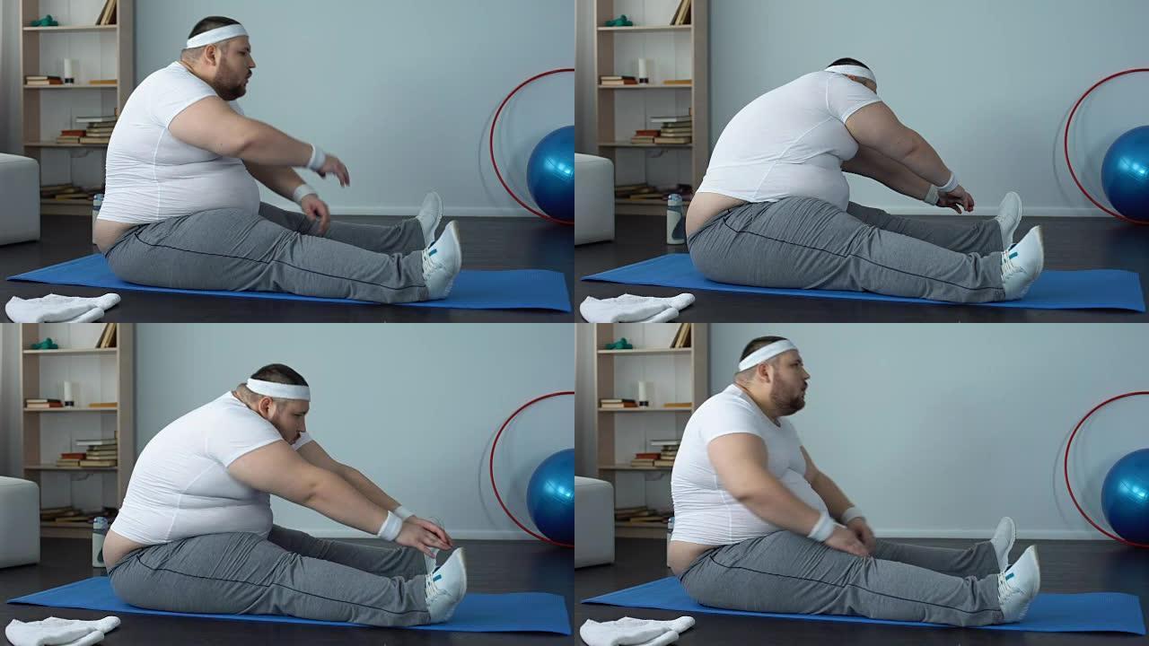疲惫的超重男子在筋疲力尽的训练后伸展并摔倒在垫子上
