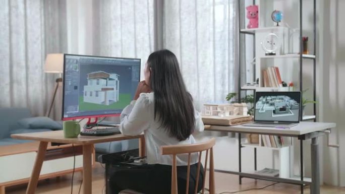 亚洲女性工程师在家里桌面设计房子时思考。网络游戏屋设计与装修