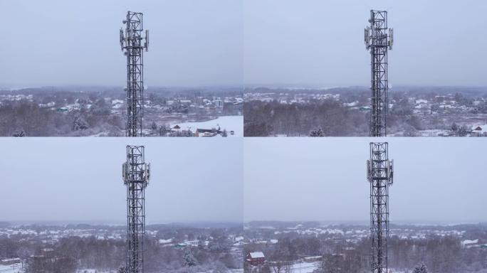 塔式天线电信手机的鸟瞰图，蜂窝5g 4g手机的无线电发射器。提供高速现代5g交通网络服务。雪自然森林