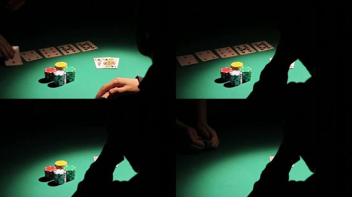 沉迷于赌博的男人在玩扑克时输光了所有的钱，