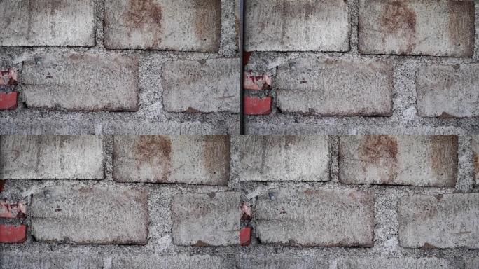 灰砖煤渣砌块墙背景灰色混凝土瓦覆层无缝纹理。特写