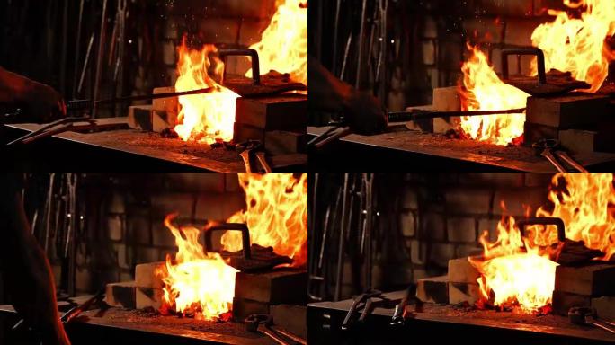一个铁匠的特写镜头，用这些工具扇动炉子的火焰，防止余烬，火花以慢动作飞向侧面。铁匠手的特写