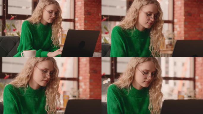 快乐的女人在咖啡馆的笔记本电脑上在社交网络上在线聊天，连接到免费无线网络，肖像