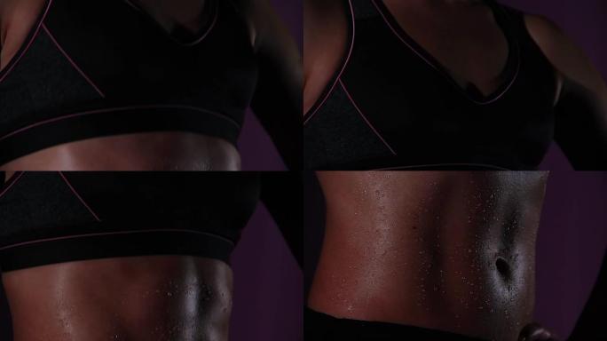 身材火辣的女运动员，完美平坦的腹部，女人表现出理想的肌肉