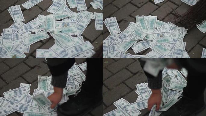 街道清洁工清扫并收集美元，货币贬值，危机