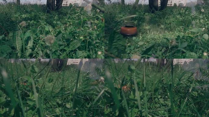 割草机割高绿草，一片片草飞来飞去。慢动作，慢动作