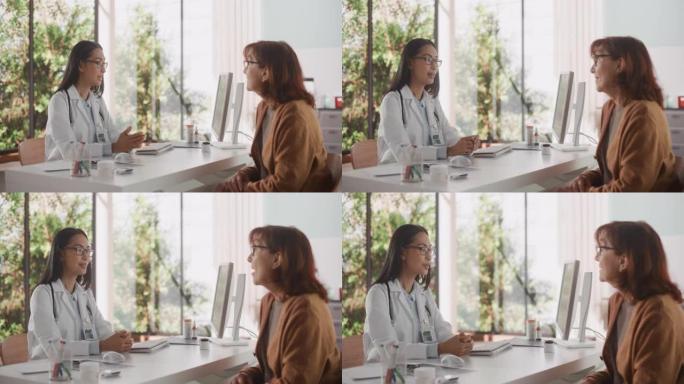 亚洲女医生在健康诊所的一次咨询中与一名高级女性交谈。穿着白大褂的医生建议在医院办公室对老年患者进行治