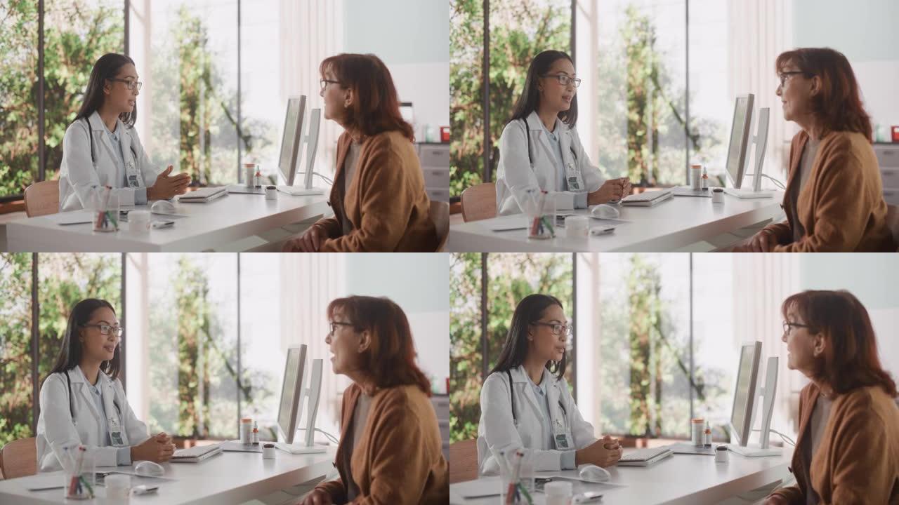 亚洲女医生在健康诊所的一次咨询中与一名高级女性交谈。穿着白大褂的医生建议在医院办公室对老年患者进行治