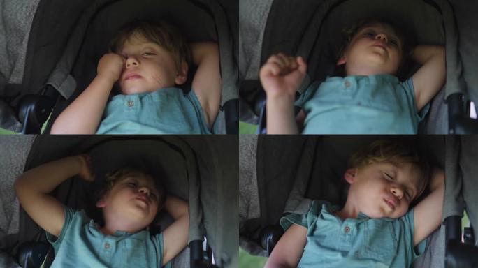 一个疲惫的小男孩午睡后醒着，坐在婴儿车里。精疲力竭的孩子不想起床。小睡后压力很大的孩子