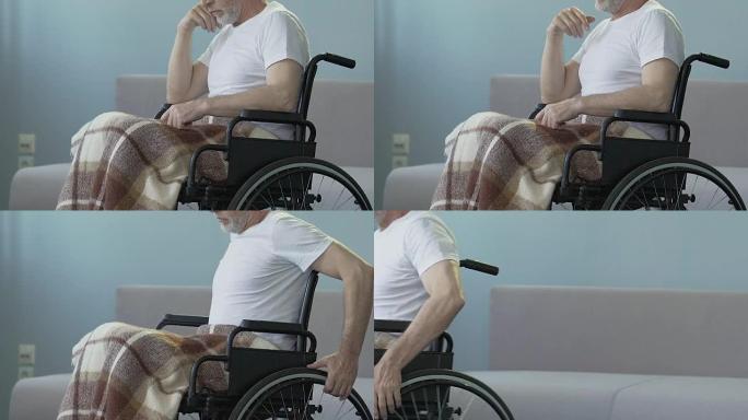 受伤的男子坐在轮椅上，开始推动双手努力康复