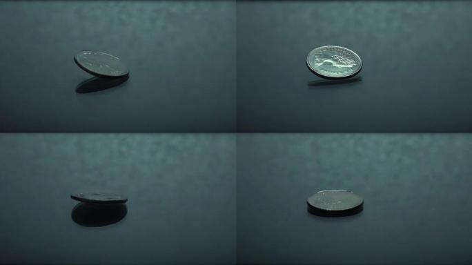 古老的银币在玻璃桌上旋转-mo，金融，储蓄，命运