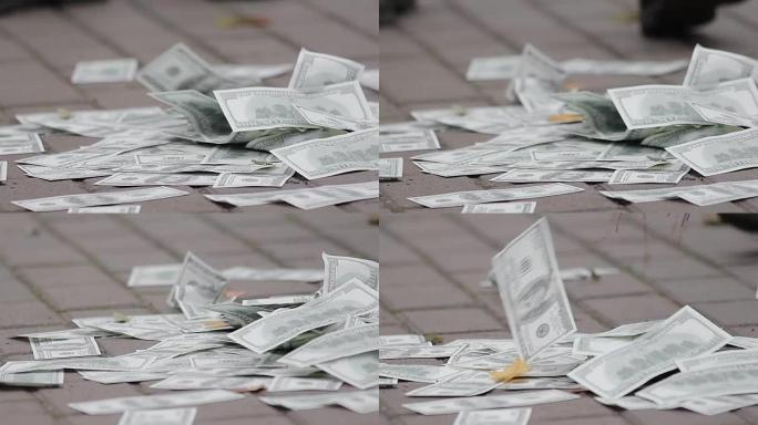 地上一堆假钞，有人扫假钞，特写