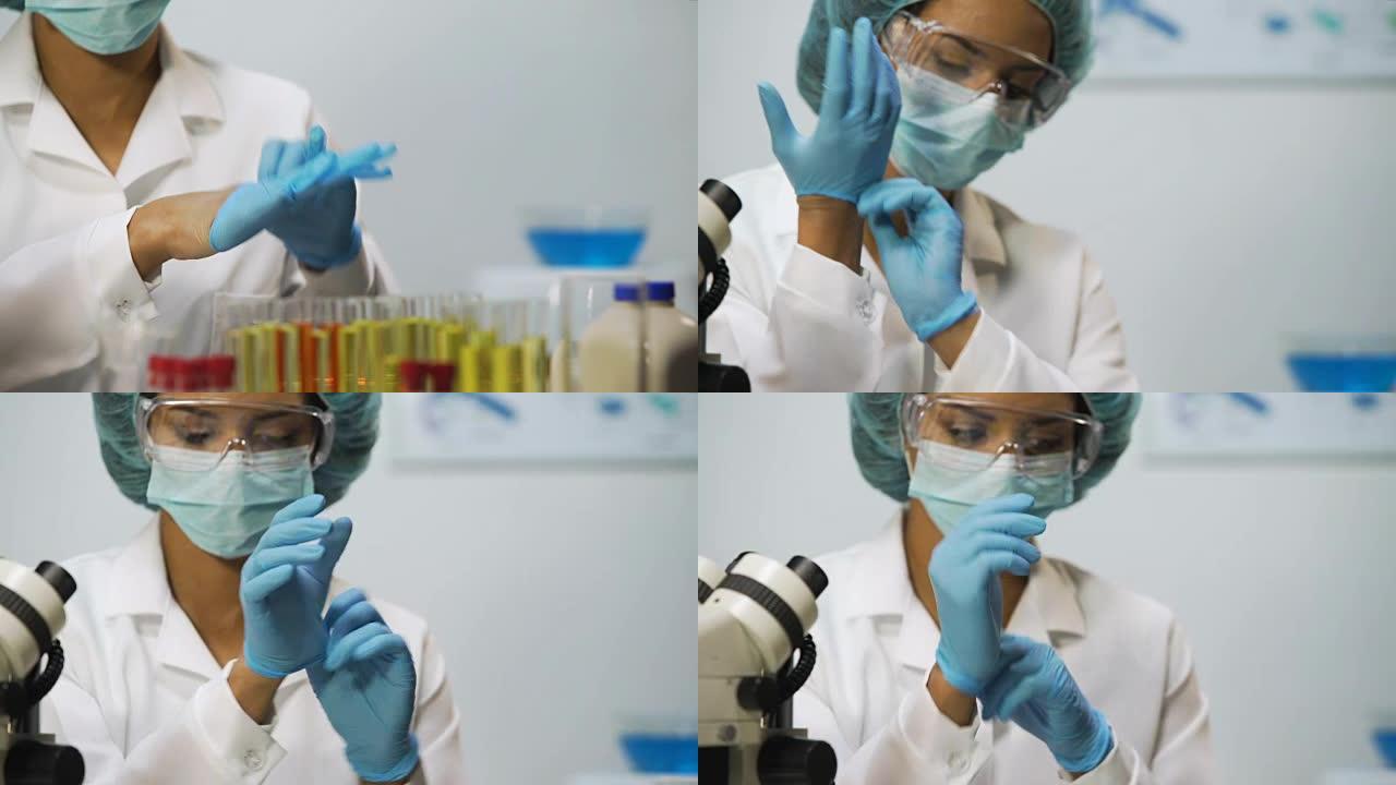 女人在实验室戴上乳胶手套，为研究做准备的科学家