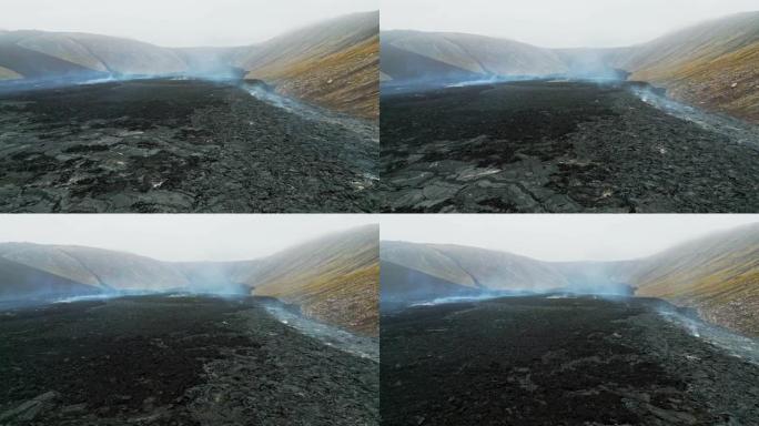 无人机飞越Geldingadalir活火山附近热气腾腾的热土