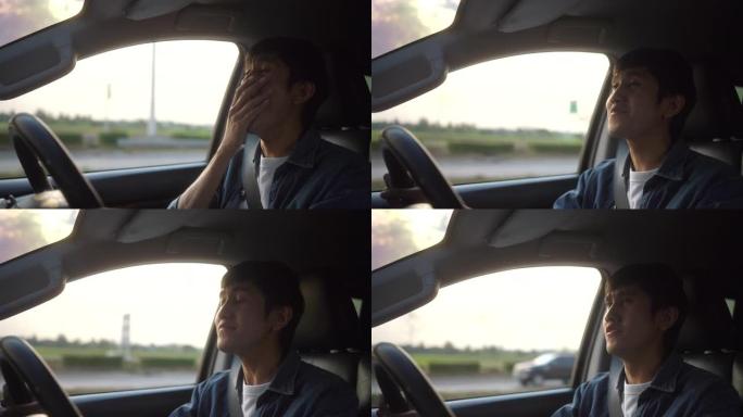 疲惫的年轻亚洲男子司机昏昏欲睡。他打了个哈欠，正要睡着。打瞌睡，长时间开车，睡眠不足