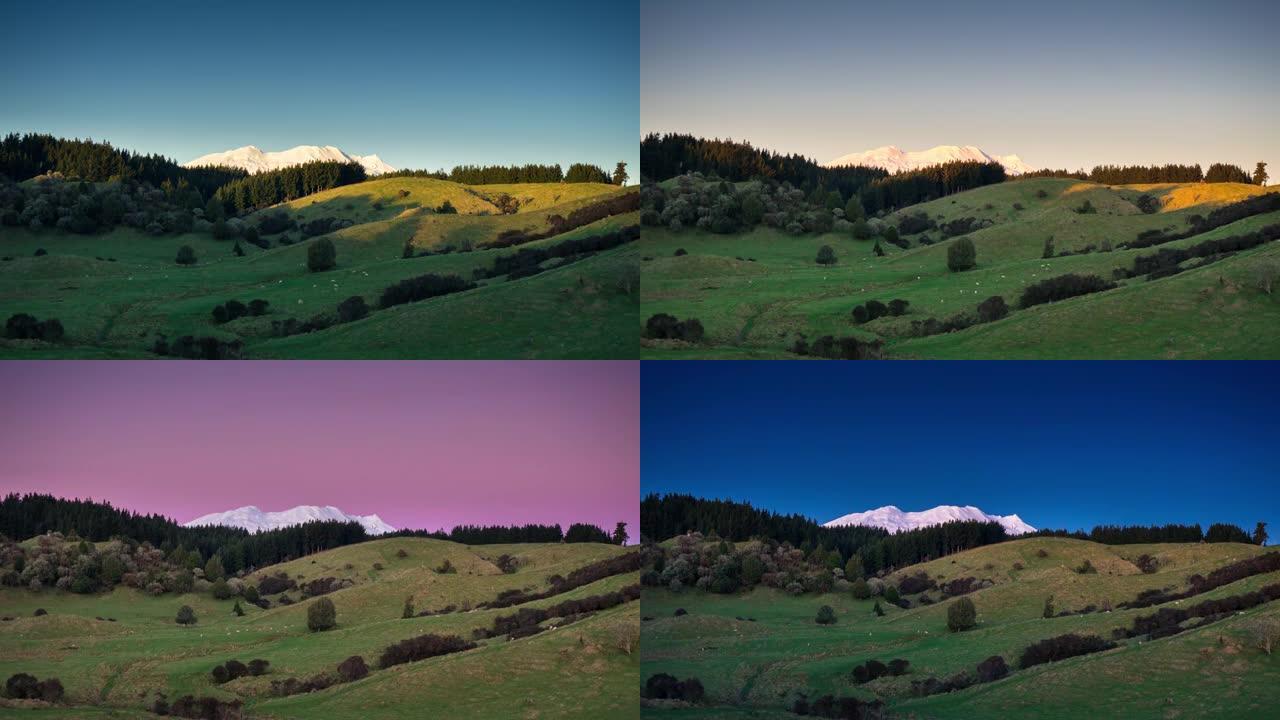 日落时分，雪覆盖的Ruapehu山在田园山上窥视-时间流逝