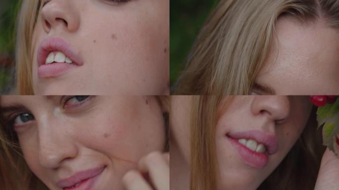 一个迷人的金发女孩的脸的极端特写镜头，自然化妆调情，触摸她的嘴唇和头发。与红色浆果合影的模特。