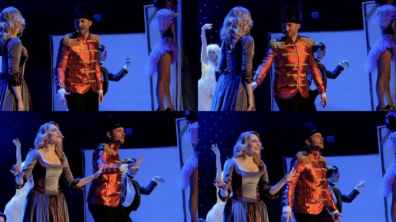 美女在剧场的舞台上与帅哥一起唱歌