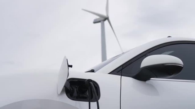 电动汽车、充电站和风力涡轮机的逐步结合。