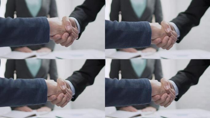 男女伙伴握手，达成协议，外交关系
