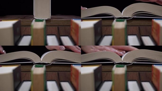 年轻女孩在书架的背景上看书