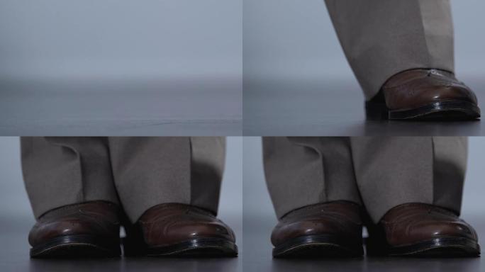 棕色皮鞋中的男性腿，优雅的男士服装，复古时尚设计