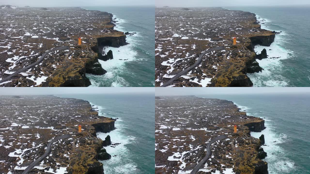 在暴风雨中，海岸线击中大浪的4k航拍画面。碧蓝的水与黑色火山岩相遇。